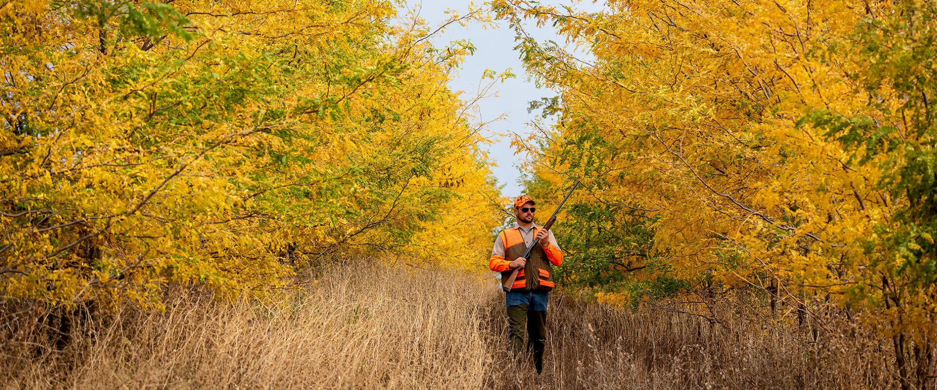 Hunter in a wind row - Photo by Travel South Dakota.